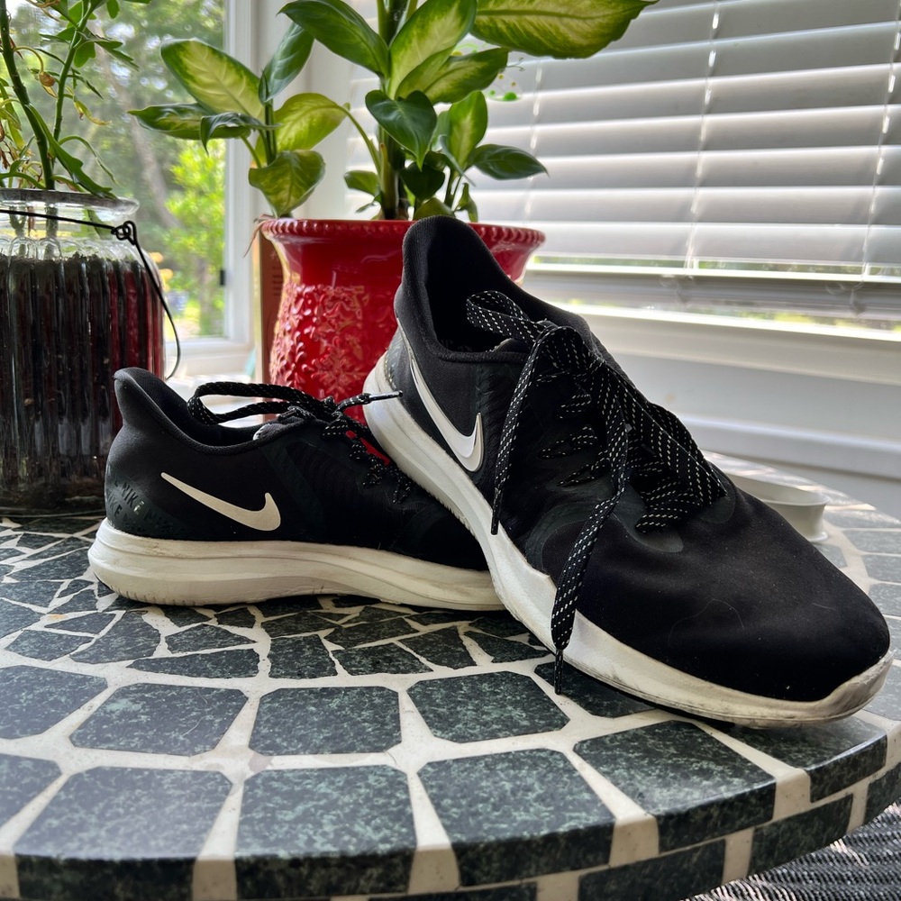 Nike In Season TR 8 in a size 9. Black on black with white soles.